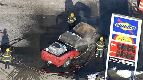 Pickup truck catches fire at gas station in Boston